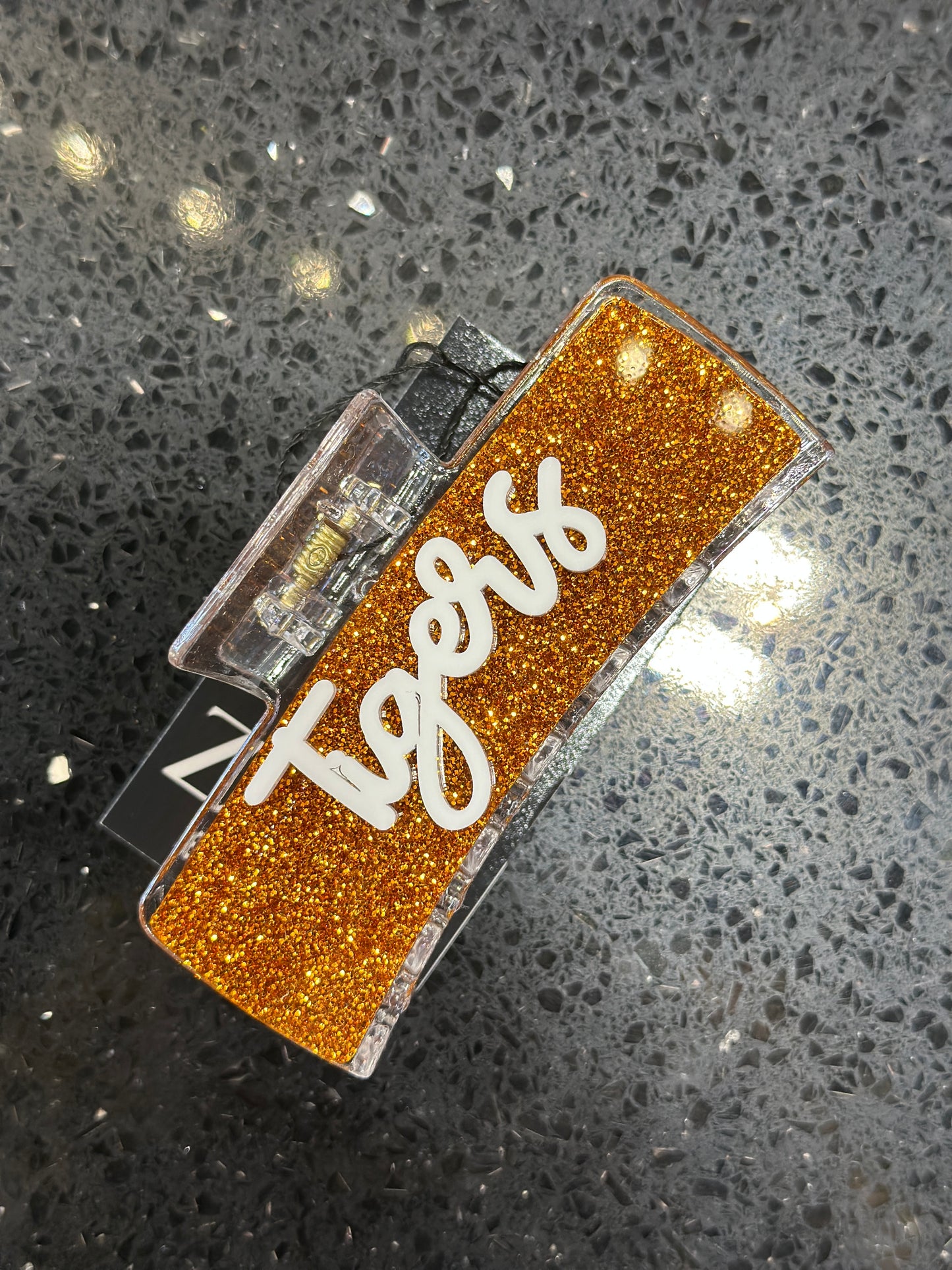 Tigers orange glitter with white writing hairclip