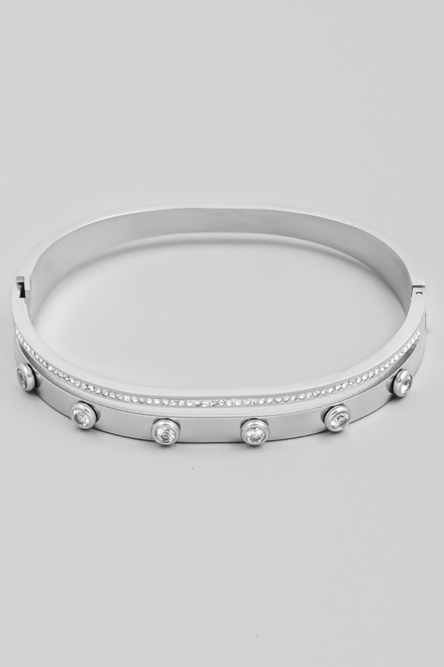 close up flat lay view of dove studded bang bracelet  in silver 